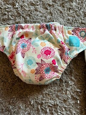 Charlie Banana Floral Diaper Cover in Cream with Pink, Teal & Coral Flowers
